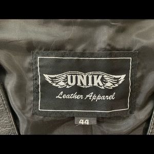 UNIK - Men's 44 leather motorcycle vest with snaps. Never worn, no wear.